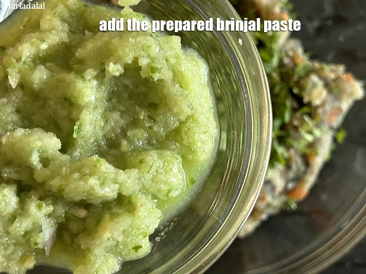 Step 23 – <p>Add the<strong> prepared brinjal paste</strong>.</p>