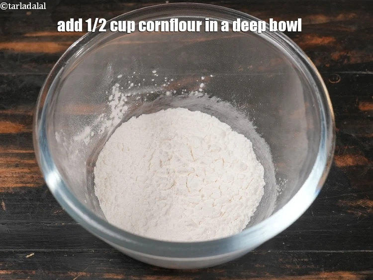 Step 26 – <p>For the <strong>cornflour slurry</strong>, Add 1/2 cup cornflour in a deep bowl.</p>