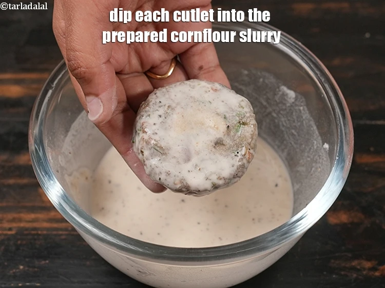 Step 33 – <p>Dip each cutlet into the prepared cornflour slurry.</p>