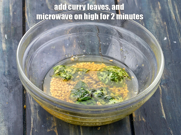 Step 14 – <p>Add a pinch of <a href="https://www.tarladalal.com/glossary-asafoetida-hing-113i"><u>asafoetida (hing)</u></a>, add 5 to 6 <a href="https://www.tarladalal.com/glossary-curry-leaves-kadi-patta-kadipatta-388i"><u>curry leaves (kadi …