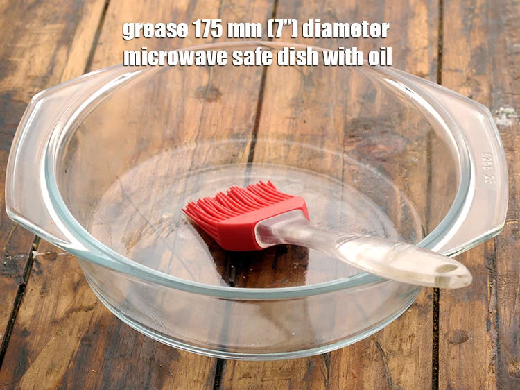 Step 7 – <p>Grease 175 mm (7”) diameter <strong>microwave</strong> <strong>safe dish </strong>with <a href="https://www.tarladalal.com/glossary-oil-671i"><u>oil</u></a>.</p>