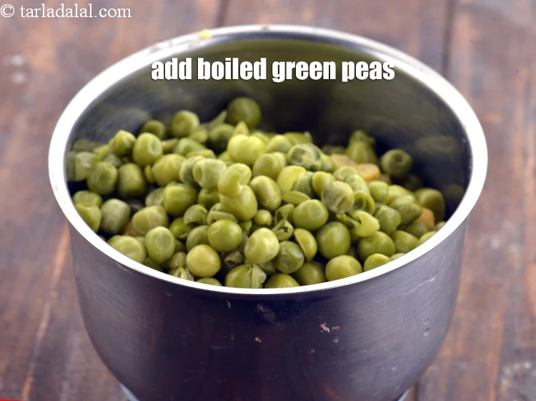 Step 16 – <p>Add ½ cup <a href="https://www.tarladalal.com/glossary-boiled-green-peas-1078i">boiled green peas</a>.</p>