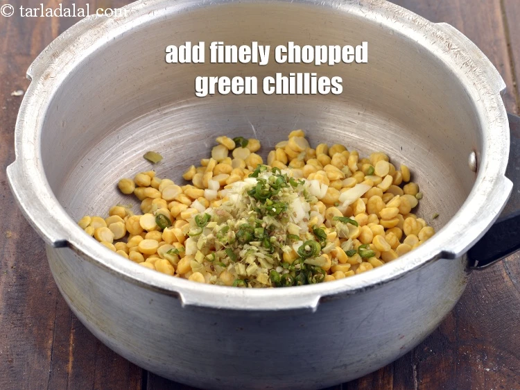 Step 10 – <p>Add 1 tbsp finely <a href="https://www.tarladalal.com/glossary-chopped-green-chilli-820i">chopped green chillies</a>.</p>