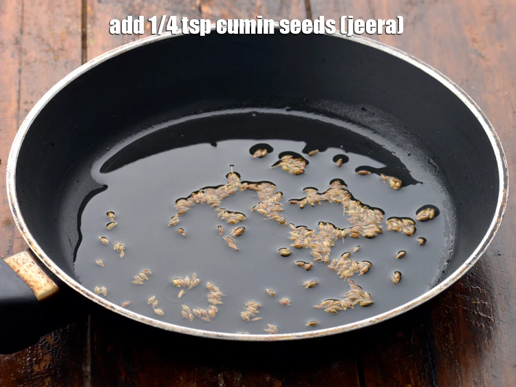 Step 7 – <p><span style="background-color:rgb(255,255,255);color:rgb(0,0,0);">Add the </span>1/4 tsp <a href="https://www.tarladalal.com/glossary-cumin-seeds-jeera-zeera-381i"><u>cumin seeds (jeera)</u></a><span style="background-color:rgb(255,255,255);color:rgb(0,0,0);">.</span></p>