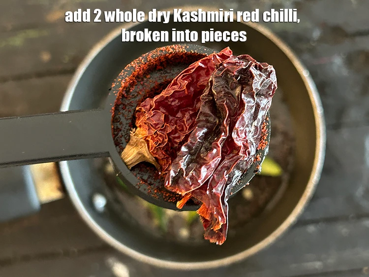 Step 9 – <p>Add 2 <a href="https://www.tarladalal.com/glossary-whole-dry-kashmiri-red-chillies-kashmiri-mirch-kashmiri-lal-mirch-332i"><u>whole dry Kashmiri red chilli </u></a>, broken into pieces.</p>