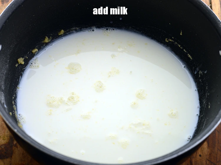 Step 12 – <p><span style="background-color:rgb(255,255,255);color:rgb(0,0,0);">Add the </span>1 1/2 cups <a href="https://www.tarladalal.com/glossary-milk-doodh-full-cream-milk-514i"><u>milk</u></a><u>.</u></p>