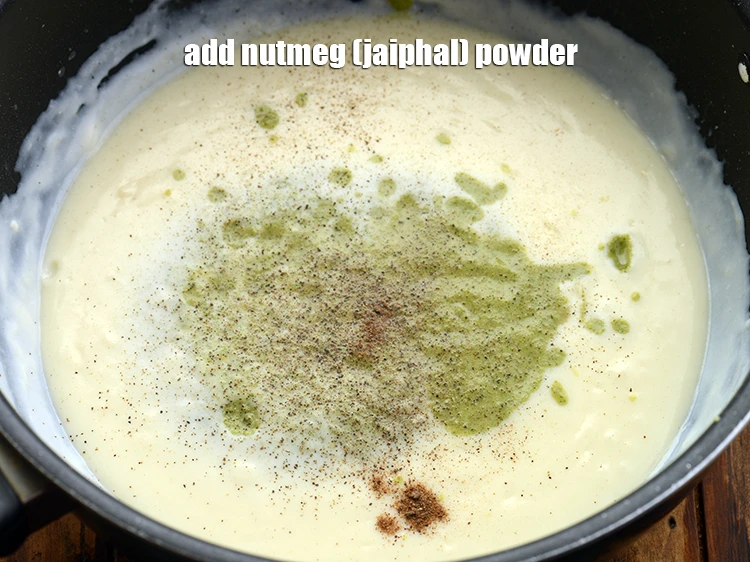 Step 17 – <p><span style="background-color:rgb(255,255,255);color:rgb(0,0,0);">Add </span>1/8 tsp <a href="https://www.tarladalal.com/glossary-nutmeg-jaiphal-468i#ing_3327"><u>nutmeg (jaiphal) powder</u></a><span style="background-color:rgb(255,255,255);color:rgb(0,0,0);">.</span></p>