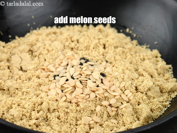 Step 23 – <p>Add 4 tsp&nbsp;<a href="https://www.tarladalal.com/glossary-melon-seeds-77i">melon seeds (charmagaz)</a>.&nbsp;</p>