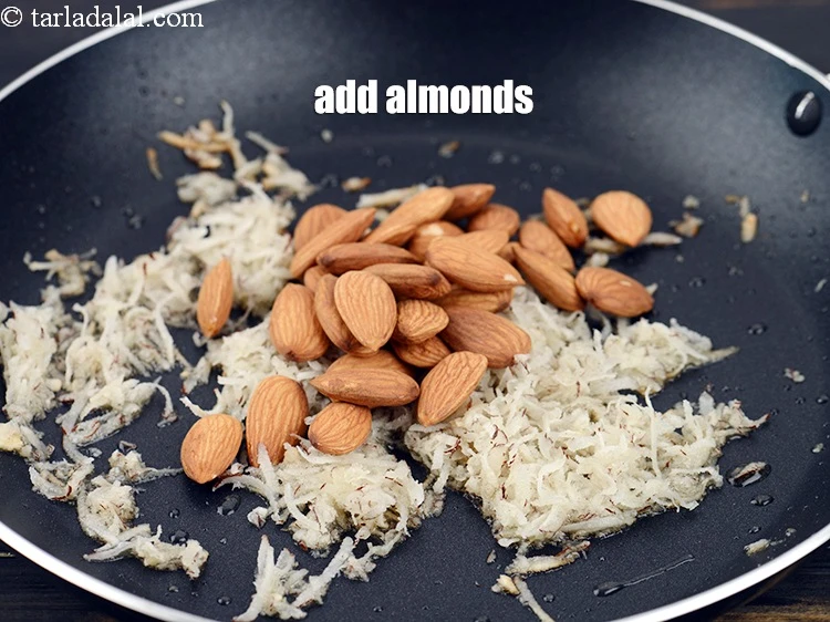 Step 10 – <p>Add 1/2 cup&nbsp;<a href="https://www.tarladalal.com/glossary-almonds-badam-378i">almonds (badam)</a>.&nbsp;</p>