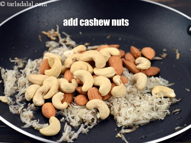 Step 11 – <p>Add&nbsp;1/2 cup&nbsp;<a href="https://www.tarladalal.com/glossary-cashew-nuts-kaju-840i">cashew nuts (kaju)</a>.&nbsp;</p>