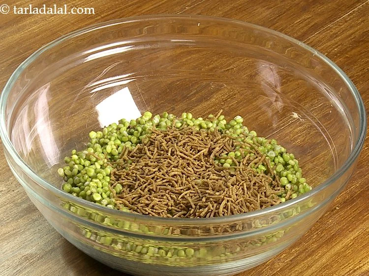 Step 2 – <p>Add 1/2 cup <a href="https://www.tarladalal.com/glossary-sev-1137i#ing_3496"><u>black pepper lemon sev</u></a>. Instead of regular besan sev, we make …