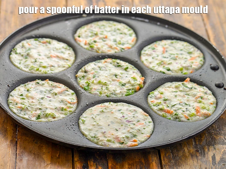 Step 14 – <p>Pour a spoonful of <strong>batter</strong> in each uttapa mould to make a 75 mm. (3") …