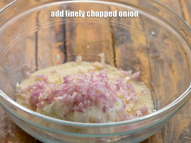 Step 4 – <p>Add 2 1/2 tbsp finely <a href="https://www.tarladalal.com/glossary-onions-pyaz-pyaaz-kanda-548i#ing_2327"><u>chopped onion</u></a><u>.</u></p>