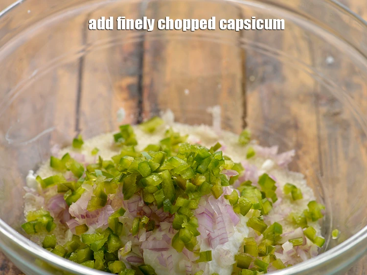 Step 5 – <p>Add 2 1/2 tbsp finely <a href="https://www.tarladalal.com/glossary-capsicum-shimla-mirch-bell-pepper-163i#ing_2311"><u>chopped capsicum</u></a>. To make the&nbsp;<strong>Mini Rava Vegetable Pankcake</strong>&nbsp;colorful, also …