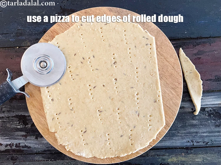 Step 20 – <p>Use a pizza cutter and cut the edges off the dough off and keep aside …