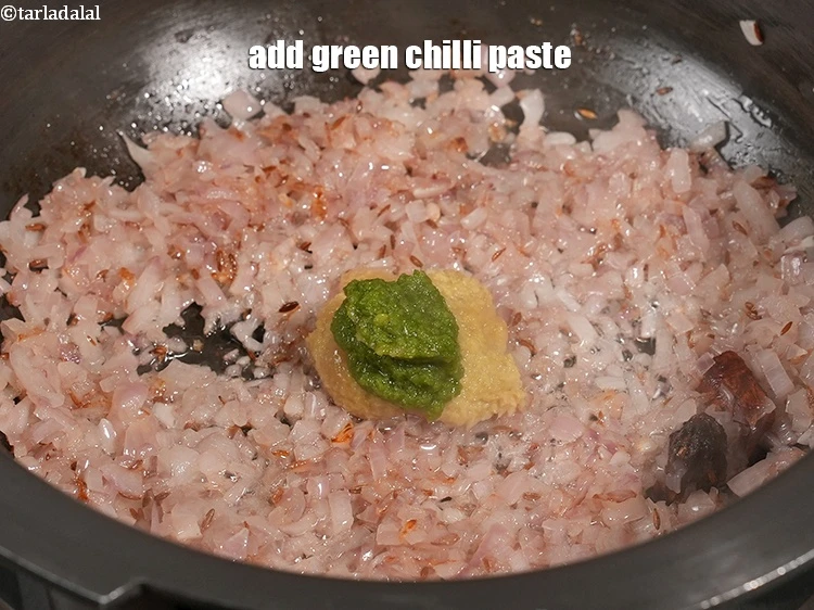 Step 12 – <p>Add 1 tsp <a href="https://www.tarladalal.com/glossary-green-chilli-paste-hari-mirch-ki-paste-mirchi-paste-333i">green chilli paste</a>.</p>