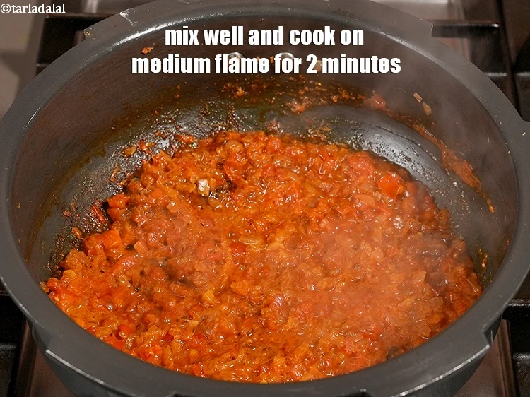 Step 21 – <p>Mix well and cook on medium flame for 2 minutes, while stirring occasionally.</p>