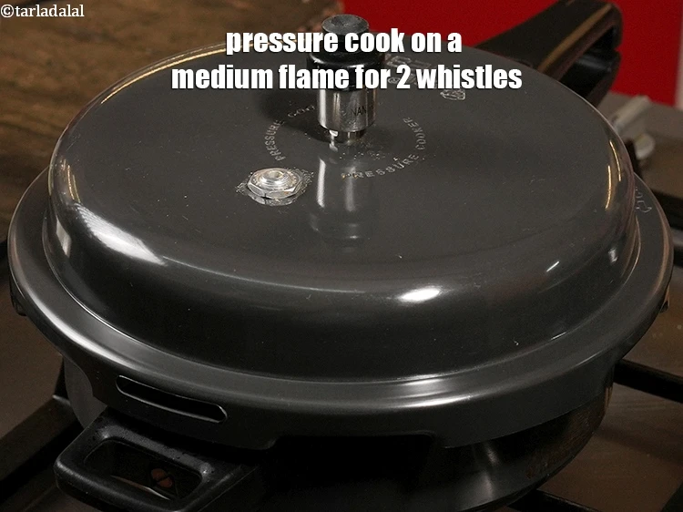 Step 27 – <p>Pressure cook on a medium flame for 2 whistles.</p>