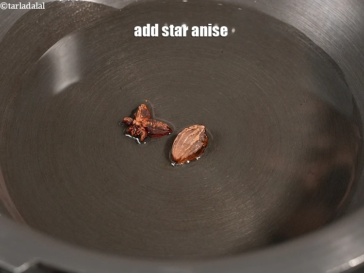 Step 5 – <p>Add 1 <a href="https://www.tarladalal.com/glossary-star-anise-chakri-phool-623i">star anise (chakri phool)</a>.&nbsp;</p>