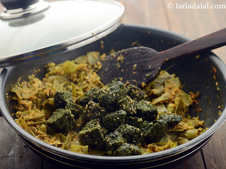 Step 17 – <p>Add the muthia. Learn how to make <a href="https://www.tarladalal.com/palak-methi-na-muthia-gujarat-recipe-554r">palak methi muthia</a> at home.&nbsp;</p>