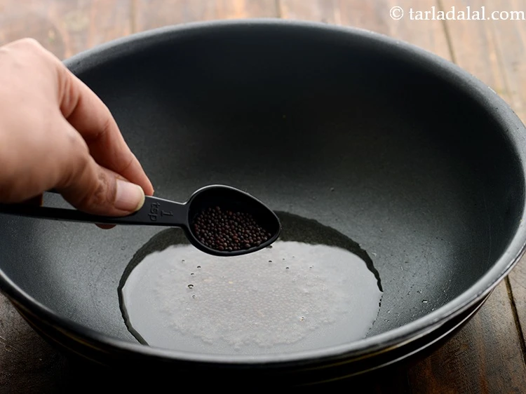 Step 6 – <p>Once the oil is hot, add mustard seeds.&nbsp;</p>