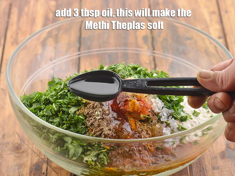 Step 13 – <p>Also 3 tbsp <a href="https://www.tarladalal.com/glossary-oil-671i"><u>oil</u></a>. This will make the <strong>Methi Theplas </strong>soft.</p>