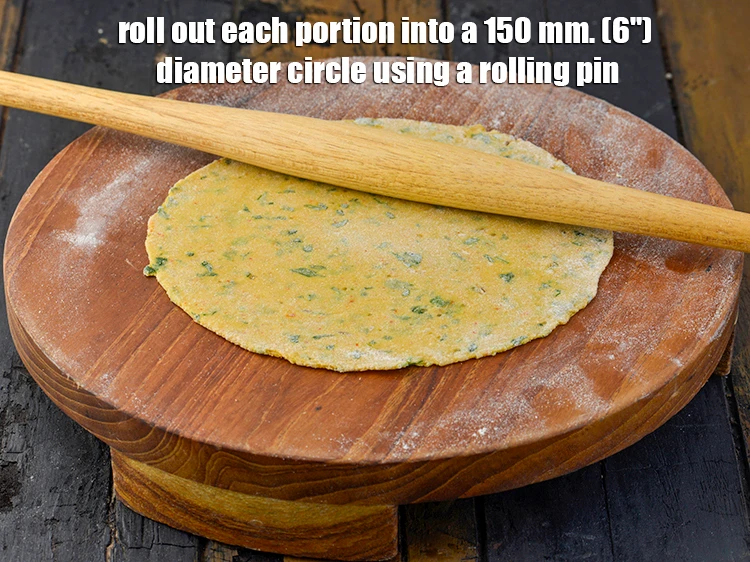 Step 22 – <p><strong>Roll</strong> out each portion into a 150 mm. (6") diameter circle using a rolling pin.</p>