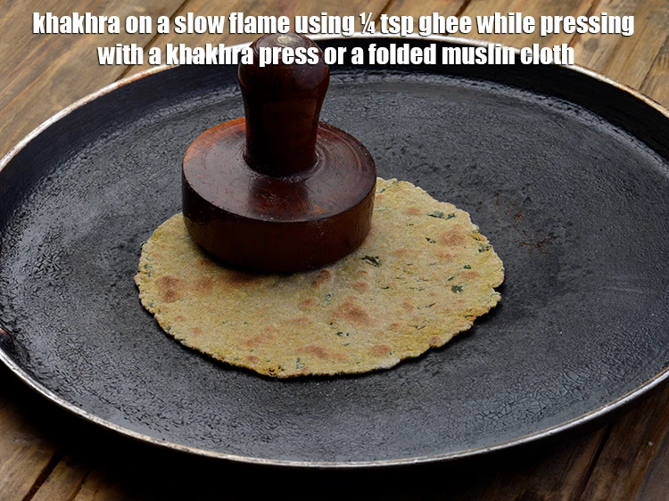 Step 5 – <p><span style="background-color:rgb(255,255,255);color:rgb(0,0,0);">Continue cooking the <strong>khakhra</strong> on a slow flame using ¼ tsp </span><a href="https://www.tarladalal.com/glossary-ghee-245i"><u>ghee&nbsp;</u></a><span style="background-color:rgb(255,255,255);color:rgb(0,0,0);"> …