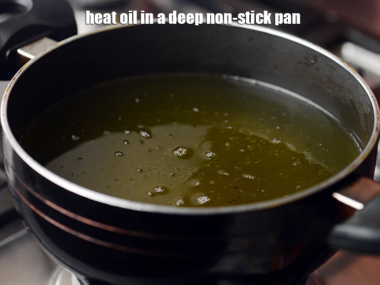 Step 11 – <p><span style="background-color:rgb(255,255,255);color:rgb(0,0,0);">Heat the </span><a href="https://www.tarladalal.com/glossary-oil-671i"><u>oil</u></a><span style="background-color:rgb(255,255,255);color:rgb(0,0,0);"> in a deep non-stick pan.</span></p>
