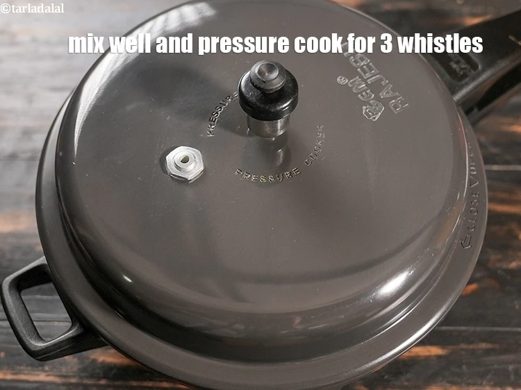 Step 6 – <p>Mix well and pressure cook for 3 whistles.</p>