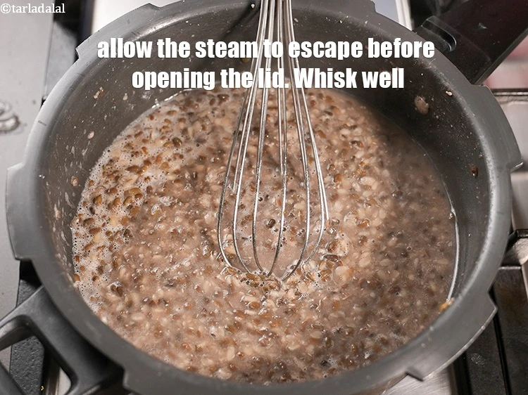 Step 7 – <p>Allow the steam to escape before opening the lid. Whisk well and keep aside.</p>