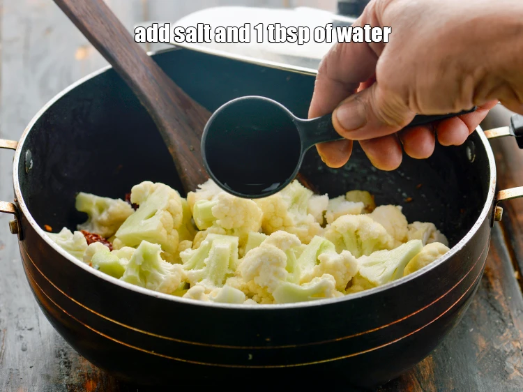 Step 16 – <p>Add the <a href="https://www.tarladalal.com/glossary-salt-namak-table-salt-418i"><u>salt </u></a>to taste and 1 tbsp of <strong>water</strong>.</p>