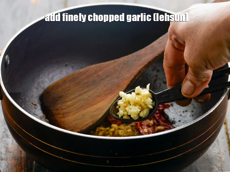 Step 10 – <p>Add the 1 tsp finely <a href="https://www.tarladalal.com/glossary-garlic-lehsun-lahsun-348i#ing_2370"><u>chopped garlic (lehsun)</u></a>. If you are Jain, then skip …