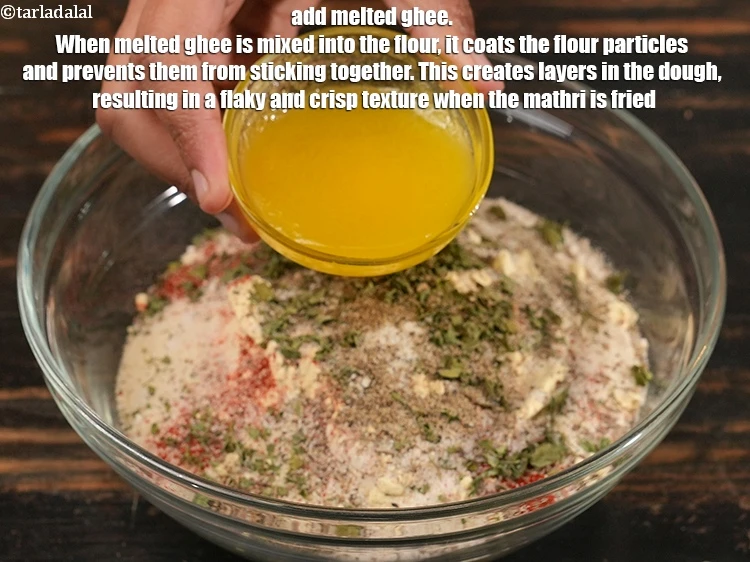 Step 14 – <p>Add 4 tbsp melted <a href="https://www.tarladalal.com/glossary-ghee-245i">ghee</a>. When melted ghee is mixed into the flour, it …