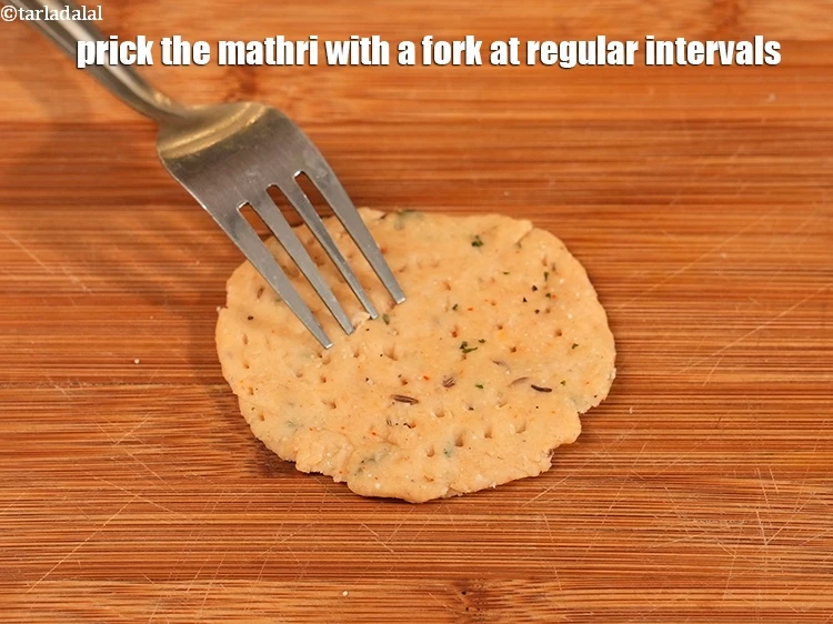 Step 21 – <p>Prick the mathri with a fork at regular intervals.Repeat steps 3 and 4 to make …