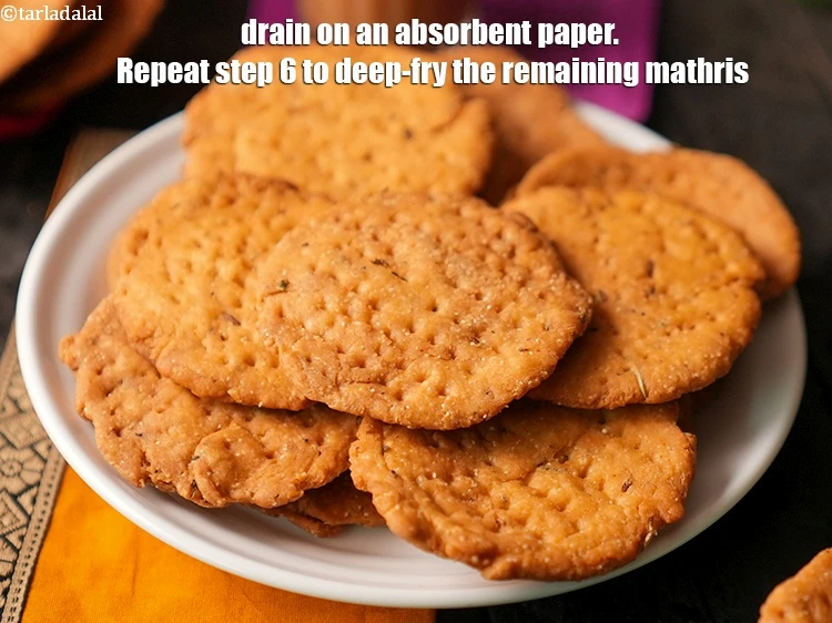 Step 25 – <p>Drain on an absorbent paper. Repeat step 6 to deep-fry the remaining mathris.</p>