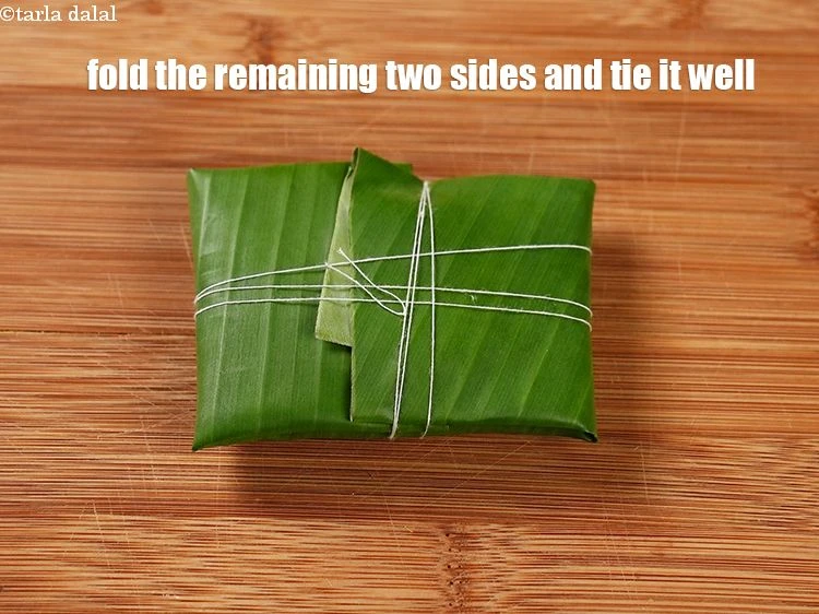 Step 19 – <p>Fold the remaining two sides towards the center overlapping it, and tie it well using …