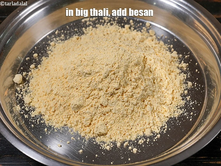 Step 3 – <p>In big thali, add 2 cups of <a href="https://www.tarladalal.com/glossary-besan-chana-dal-flour-bengal-gram-flour-952i">besan (bengal gram flour)</a>.&nbsp;</p>