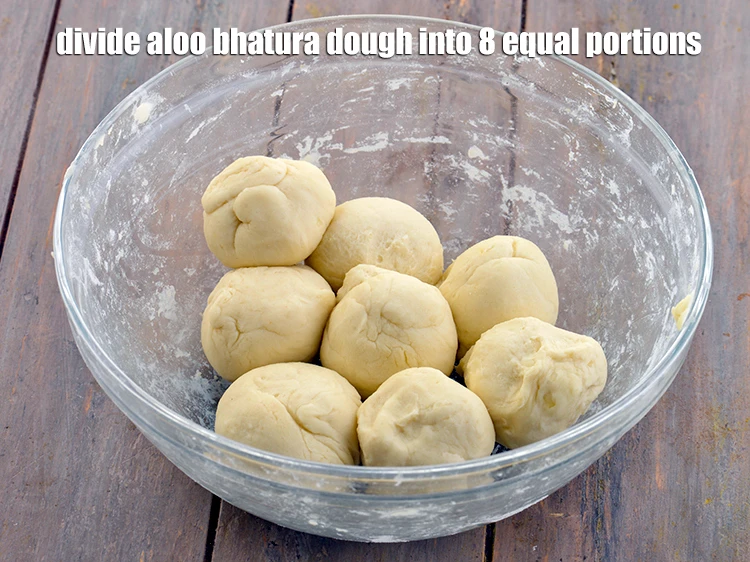 Step 38 – <p>Remove the muslin cloth. Divide the <strong>aloo bhatura</strong> dough into 8 equal portions.</p>
