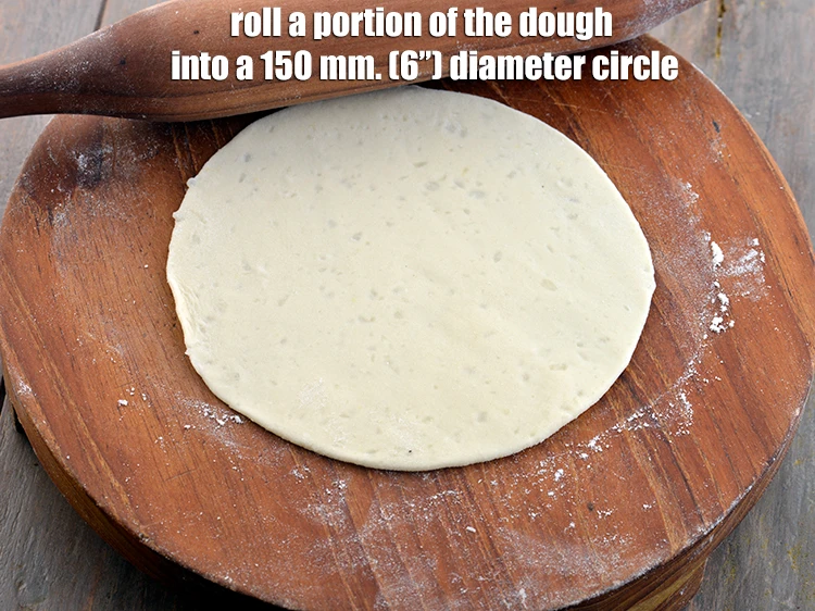 Step 39 – <p>Roll a portion of the dough into a 150 mm. (6”) diameter circle using a …