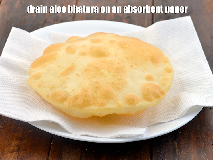 Step 47 – <p>Drain&nbsp;<strong>aloo bhatura&nbsp;</strong>on an absorbent paper. Keep aside.</p>