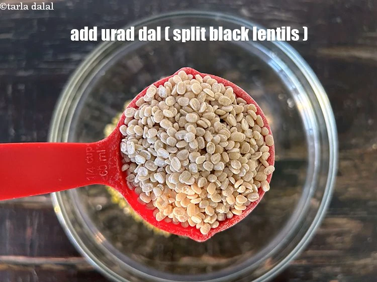 Step 4 – <html><head></head><body><p>Add&nbsp;1/4 cup&nbsp;<a href="glossary-urad-dal-split-black-lentil-941i">urad dal (split black lentils)</a>.</p></body></html>