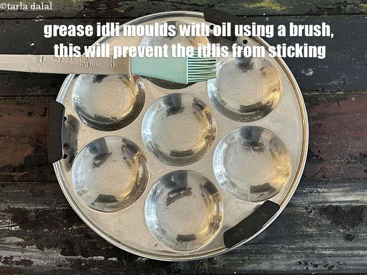 Step 29 – <p>Grease the idli moulds with oil using a brush.</p>