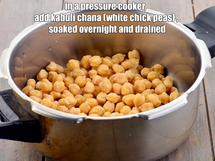 Step 7 – <p>In a pressure cooker, add the <a href="https://www.tarladalal.com/glossary-kabuli-chana-chickpeas-garbanzo-chole-chana-290i"><u>kabuli chana (white chick peas)</u></a>.</p>
