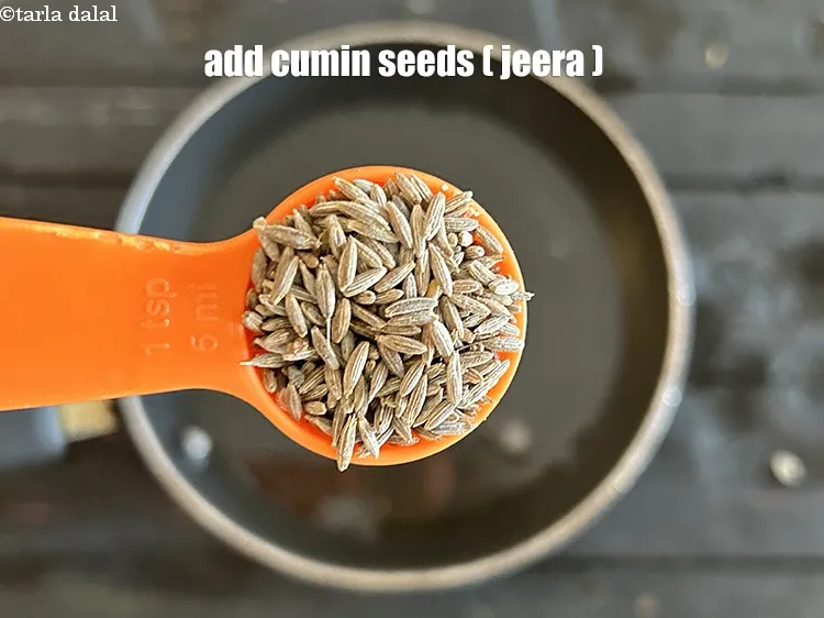 Step 16 – <html><head></head><body><p>Add&nbsp;1 tsp&nbsp;<a href="glossary-cumin-seeds-jeera-zeera-381i">cumin seeds (jeera)</a>.</p></body></html>