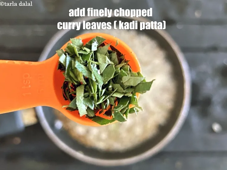 Step 20 – <html><head></head><body><p>Add&nbsp;4&nbsp;<a href="glossary-curry-leaves-kadi-patta-kadipatta-388i">curry leaves (kadi patta)</a>, <strong>finely chopped</strong>.</p></body></html>
