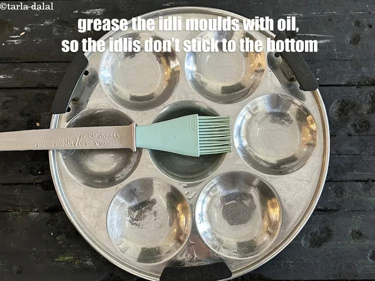 Step 25 – <p>Grease the idli moulds with oil so, that the idlis do no stick to the …
