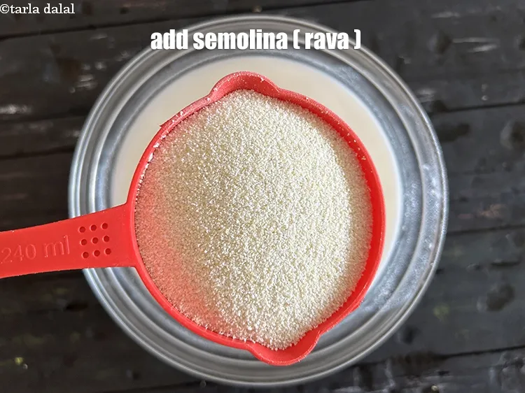 Step 7 – <p>Add&nbsp;2 1/2 cups&nbsp;<a href="glossary-semolina-sooji-rava-rawa-603i">semolina (rava)</a>.</p>