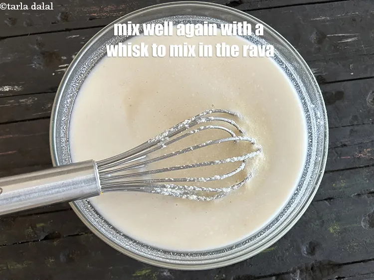 Step 8 – <p>Mix well again with a whisk to mix in the rava.</p>