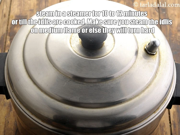 Step 26 – <html><head><meta charset="UTF-8"></head><body><p>Steam in a steamer for 10 to 12 minutes or till the idlis are …